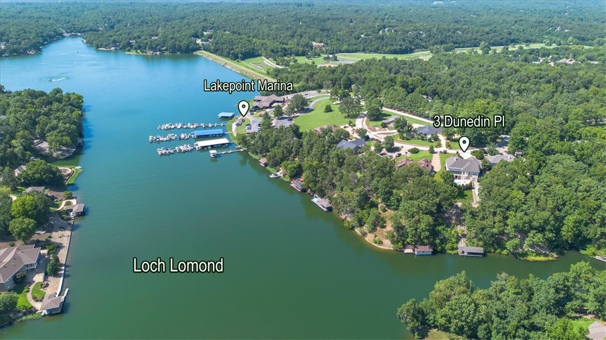 Lakefront luxury meets laid-back living on Bella Vista’s premier lake—Loch Lomond approved for short-term rental use! Over 6,000 sq. ft. architectural gem offers the perfect balance of elegance & comfort, with panoramic water views & sun-drenched spaces throughout. With 4–5 bedrooms, 3 bathrooms, & a spacious 3-car attached garage, there’s room for everyone. Entertain with ease in your private backyard oasis featuring a sparkling pool, full outdoor stainless-steel kitchen & expansive patio spaces designed for gathering. Inside, the home features two primary suites for ultimate comfort, a well-designed kitchen for the home chef, & a peaceful sunroom that fills the home with natural light. Downstairs, you’ll find bonus space for a game room, office, fitness studio, or guest quarters—plus ample storage. Professionally landscaped with a lake-fed irrigation system, this home is as practical as it is beautiful. Just a short walk to Lakepoint Restaurant and Marina, and minutes from Scottsdale Golf Course & town amenities.