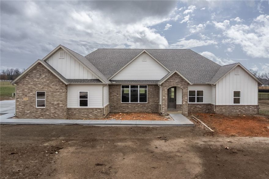 This beautiful new home features a large owner suite with huge walk-in closet and bath featuring shower and soaking tub, plus two additional bedrooms and an office which could double as a 4th bedroom. Open living/dining/kitchen with 10' ceilings open onto a covered rear porch allowing plenty of space for family enjoyment or entertaining. Kitchen features large island, gas stove with hood and gorgeous cabinetry. Entry from garage passes thru a mudroom which adjoins the utility room, then into hall to kitchen or living area. Three-car garage. Agent owned.
