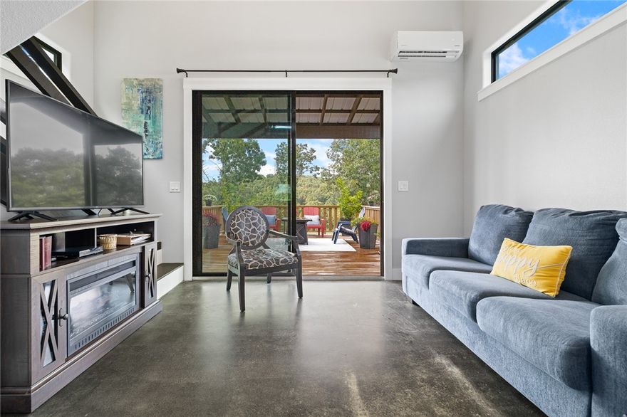 This charming one-bedroom, one-bath home is perfect for a peaceful getaway, or if you're eyeing a smart investment opportunity.  The 608-square-foot cabin makes a stylish and practical first impression--natural light filters in, highlighting the clean finishes and open layout. The exterior is wrapped in durable 12-inch LP lap siding backed by a fifty-year warranty---giving you peace of mind for years to come. Enjoy the multi-season screened in porch---and, there's already a spot close by for you to install a hot tub! The spacious deck is great for grilling, entertaining, or relaxing with a cup of coffee.  A 10 x 20 foot detached building provides flexible space for a workshop, storage or a creative studio--the possibilities are endless. 
Location is the real star here. It's just 7 min from Cricket Marina for lakeside fun, less than 20 min from Thunder Ridge Nature Arena for concerts, and 25 min to Branson Landing's shops and restaurants. Tucked behind a wood privacy fence, this home has both charm and proximity!