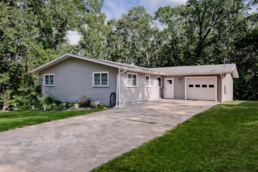 This beautifully renovated home is a dream for anyone who loves modern living & the outdoors. The main floor has an open layout w/stunning kitchen, stainless appliances, huge pantry & granite. The living room is a cozy & stylish space w/electric fireplace, custom wood beam & luxury vinyl plank flooring. Large windows let in plenty of natural light & the sunroom and deck offer peaceful views of the surrounding woods. The main bedroom is the perfect retreat w/updated bath & huge walk-in closet. The walkout basement has its own entrance, making it perfect for an in-law suite, or extra living space. You'll also find a flexible room ideal for an office/gym. The outdoor area is a private oasis w/covered deck upstairs & private patio downstairs, a firepit and a greenhouse for gardening. Lake Avalon beach area is just down the road & Lago Vista bike trail is right outside the back door. You will have easy access to all the outdoor activities that BV provides. The home also features garage with a workshop & large driveway.