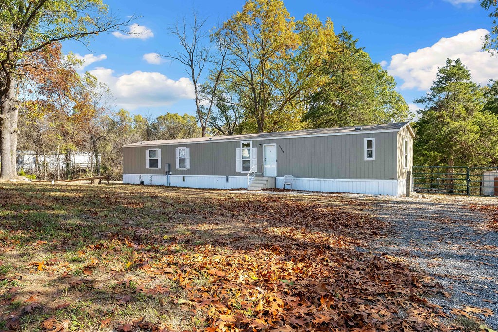 Looking to enjoy spacious living without HOA restrictions? Check out this nearly new, high-quality Champion mobile home, set on over an acre of land. Built in 2021 and lightly lived in for only a year, the home features durable T1-11 and Masonite siding plus it is engineered with extra insulation for colder climates, this isnāt your typical mobile home!
Benefit from newly installed water and electrical services, plus two frost-proof hydrants for convenience. Professional tree work has also been completed, with dead trees removed and branches trimmed back, leaving the property clear and open. This home is securely anchored, and we can provide video documentation to support financing. Inside, the layout is fresh and modern, offering an open core floor plan. Maintenance free vinyl flooring throughout the home with carpet in the bedroom. Plus a large primary bathroom and large laundry room. And don't miss the carport to the side of the property as well. Request a video tour or schedule your private showing today!