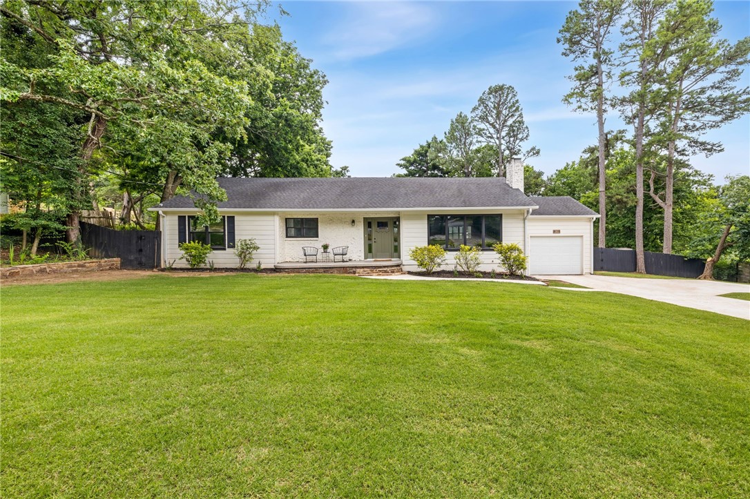 Discover this beautifully updated home at 243 E North St, nestled on a generous 0.62-acre lot in the heart of Fayetteville. This 3-bed, 2-bath home offers 2,302 sq ft of open living space centered on a cozy fireplace and a large kitchen with windows overlooking the private and meticulously maintained backyard. The oversized bonus room off the main living area provides flexible options for a den, office, playroom, or more. The main home was fully renovated in 2017 but additional extensive upgrades have been made more recently to the exterior. A major highlight of this property is the standalone Accessory Dwelling Unit in the backyard—perfect as a guest house, in-law suite, rental income opportunity, or workshop with a finishing touch. It’s equipped with its own full bath and kitchenette, offering flexibility and value rarely found in Fayetteville properties. Schedule a private tour and unlock the full potential of this rare find in one of the best locations in Fayetteville.