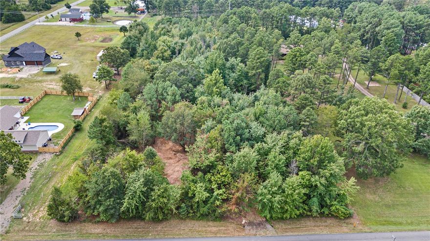 Discover the perfect spot for your dream home on this beautiful 2.71-acre parcel of land, partially secluded off of scenic Morgan Road. Enjoy the tranquility of the countryside while being just 15 minutes from Downtown Russellville, 8 minutes to Dover, and 10 minutes to Interstate 40 access.With approximately 178 feet by 623 feet of space, this property offers ample room for building and outdoor activities. County water is available, and you'll have convenient access directly from Morgan Road. This is an ideal location for creating your own private retreat while still being close to all the amenities you need. Schedule your appointment today!