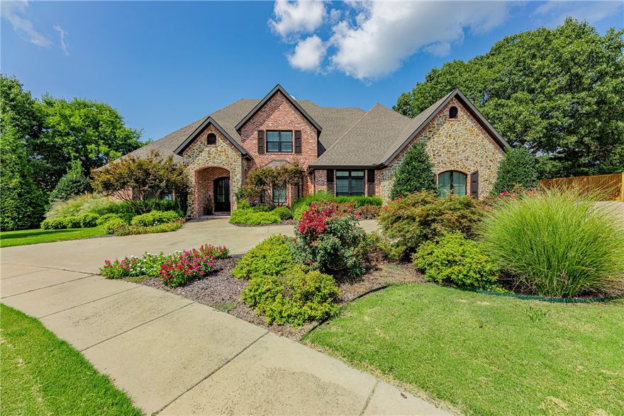 Beautiful custom built home in sought after Heritage Hills gated Community! Superb location only 1.5 miles to Tyson Headquarters. This stunning home is located at the end of a cul-de-sac and offers great curb appeal and privacy. The backyard paradise offers heated diving pool with tanning shelf and covered patio with fireplace, perfect for entertaining! The large living space offers vaulted beamed ceilings with fireplace, wood flooring and plantation shutters. Gourmet kitchen is open to the living area and boasts top grade appliances including Frigidaire refrigerator/freezer combo, gas cook top, double ovens with convection, and microwave drawer. The over sized island offers veggie sink with second garbage disposal. Also filtered and instant water, granite countertops & pantry. Formal dining room. Spacious master bedroom includes fireplace, double walk in closets, freestanding tub and oversized walk in shower! Tons of attic storage. 3 car side load garage. New roof and gutters 2022.