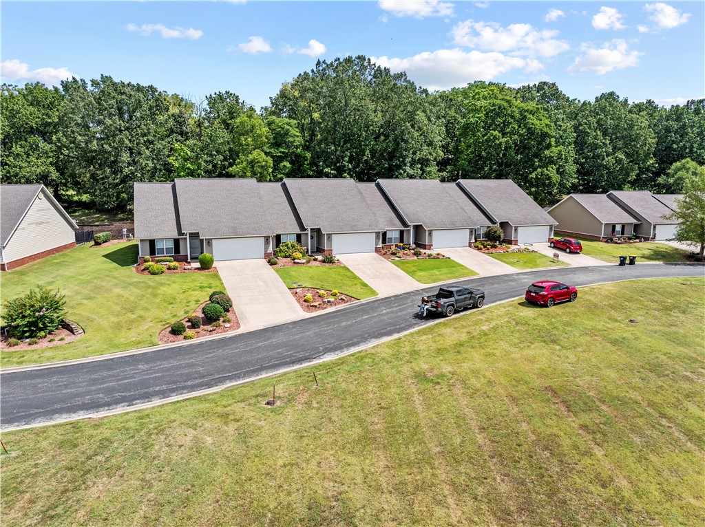 Welcome to Regency Condominiums! This beautifully maintained 2-bedroom, 2 bath home offers over 1,700 sq ft of comfortable living just minutes from Harrison Country Club and golf course. The study could serve as a 3rd bedroom with slight modification. Enjoy a spacious open floor plan with large windows, walk-in closets, and plenty of storage. The kitchen is equipped with modern appliances and opens to the living and dining areas, perfect for entertaining. Sunroom that lead to the back yard is a perfect place to relax and unwind. The primary suite features a private bath and generous closet space. Outside, you'll appreciate the landscaped lot, concrete drive and attached garage. New roof installed Sept. 2025. Many of the home's systems have been recently updated including a newer HVAC and new carpet throughout. Home has a wired generator. Low-maintenance exterior and a convenient location make this property an ideal choice for easy living in Harrison.