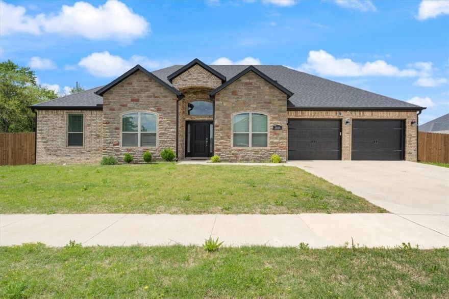 This charming home features a well-designed floor plan that welcomes the morning sun. Enjoy meals in the cozy breakfast nook or host guests in the formal dining area. Step outside to the spacious 18x12 covered patio, complete with a gas log fireplace—perfect for year-round entertaining. The master suite offers a luxurious retreat with a large walk-in rain shower. Throughout the home, you'll find stylish 2" faux wood blinds and no carpet for easy maintenance. The backyard is fully enclosed with a 6-foot wood privacy fence, providing comfort and seclusion.