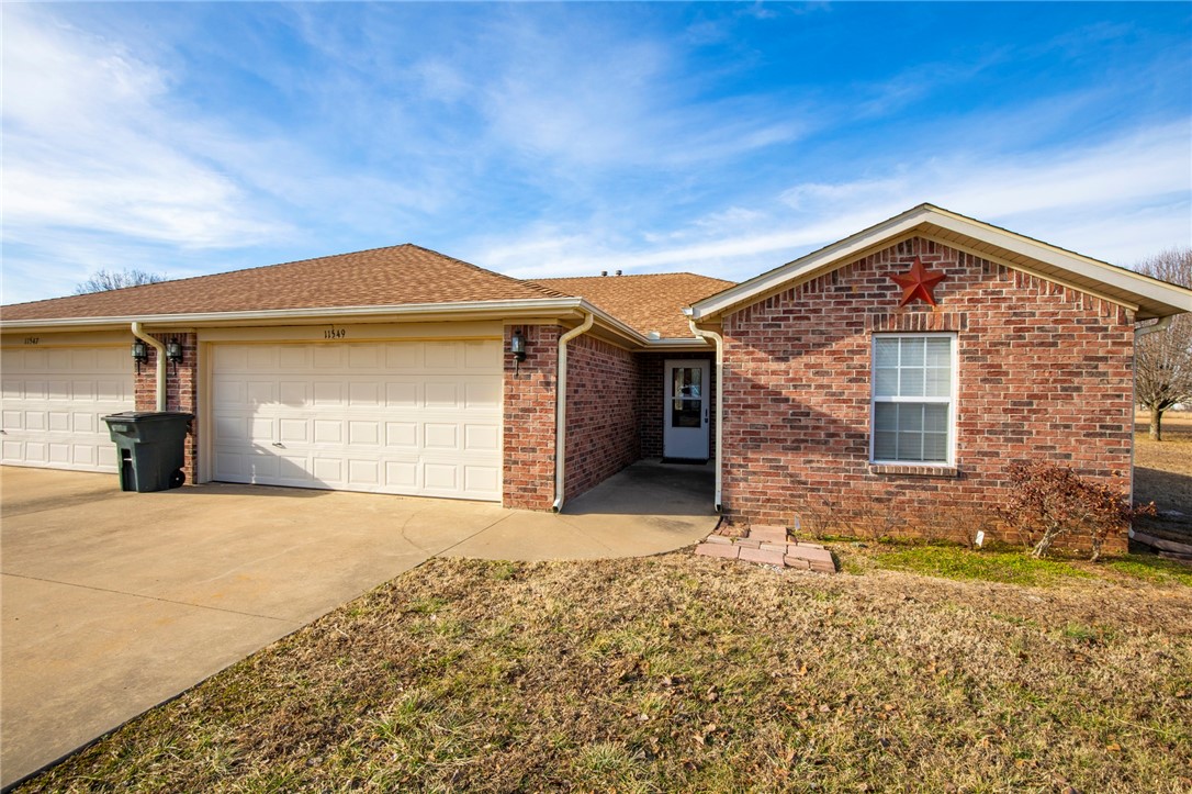 Great 3 bedroom 2 bath duplex located on a large open lot in a country setting just outside of the Rogers city limits. This unit features a large living and dining space and a spacious kitchen with plenty of countertop and storage. Vinyl plank wood style flooring throughout. Out back enjoy a very large covered patio that opens up to a open yard with a large storage building.