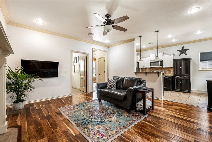 Motivated seller! Charming cottage in the desirable Sunbridge Villas, centrally located in Fayetteville! This 3-bedroom, 2-bath home is packed with upgrades, including stainless steel appliances, engineered wood flooring, a new HVAC system (2021), hot water heater (2022), plus a newer roof and added deck. The spacious primary suite features a cozy sitting area with French doors leading to the deck. Enjoy outdoor living with a covered porch just off the kitchen, perfect for grilling. Refrigerator, washer, and dryer convey with an accepted offer. Located just 2.5 miles from the University of Arkansas campus, this home is the perfect blend of comfort and convenience!