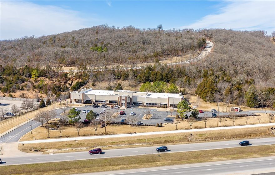 Office building for sale being sold vacant. Excellent location with visibility to I-49. Vehicles per day is 59,000.