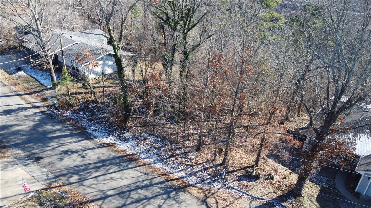 Looking to make Bella Vista your new home? Then look no further- this lot is the one for you! Located 5 short minutes from multiple grocery stores, gas stations and restaurants. It backs up to the Bamboozled Trail and only one block away from the Tunnel Vision off 279- any mountain biker's dream! Bella Vista offers top-notch recreational facilities including swimming pools, tennis courts, golf courses and fitness center for those who enjoy active lifestyle. Check this beauty out today!