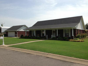 Picture Perfect corner lot! Features two lots, with an immaculate 1728 Sq Ft home, 16 X 40 RV Canopy Carport and 576 Sq Ft, attached, insulated shop complete with large patio area and chain linked fence! Concrete driveways and sidewalks; extra parking at the garage entrance complete with a storm cellar! Handicap accessible with a new $15,000 Walk-in shower/tub Sauna!