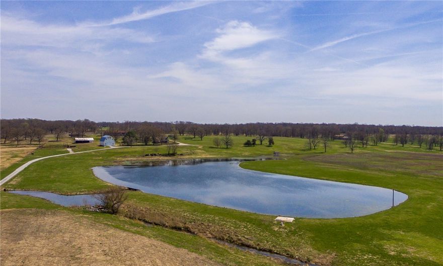 560 +/- Ac.,. 480 ac., pasture and 80 acres timber. Stately working ranch with a 6 acre spring fed lake stocked with fish, a year round spring and spring fed creek. The water source for home is a spring. 36 x 60 barn, 60 x 24 pole shed, 120 x 24 pole shed and 100 x 50 loafing pole shed. Adorable rustic cabin with approx. 1576 sf, 2BR/2BA, 2- levels. 25 Minutes from Bentonville located on pavement Hwy 72. A very unique setting. Site of Civil War Union Camp - Walker Spring branch runs through the property.