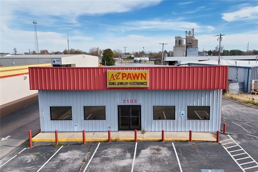 Unlock the potential of this .68 acre lot & building w/ 123' of major highway frontage, providing exceptional visibility + 2 access points for easy entrance. Located in a thriving area w/ C2 zoning, it’s surrounded by prominent, high traffic businesses like Walmart, Dollar General, George's Chicken, Aldi’s Grocery, Walgreens, and Arvest Bank. The 3380 sq. ft. building is in excellent condition and features 14’ ceilings, offering a spacious, versatile interior w/1 full bath, 1 half bath, huge back room, drive through door/window, and a dedicated office space – ideal for operations, inventory, storage or meetings. Also includes 16 front parking spaces, ensuring convenience for customers and staff. Perfect for a startup biz or one wanting to grow! The green space at the back offers potential for additional parking or building expansion. Contact city for zoning approvals, variances, CUPs, etc. is a rare find for business owners or investors seeking a vibrant, growing area. Don’t miss this premium commercial property!