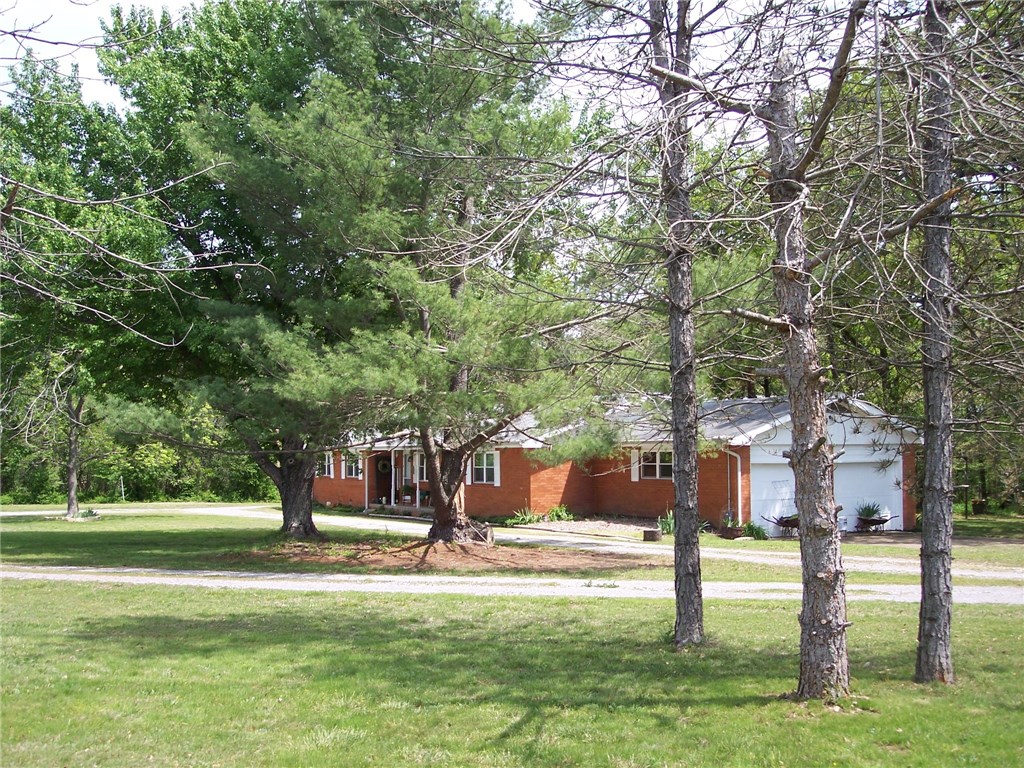 Brick ranch home, 1 level Private 9 acres just outside city limits.