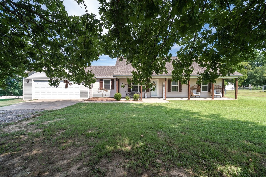 Well loved & maintained 3 bedroom, 2 bath with open kitchen & dining. Carpet in bedroom, wide planked laminate in dining & living, tile in wet areas. All SS appliances, fridge conveys. Total electric home but a gas line in front of home. 2 car garage, breakfast bar & huge fenced backyard.
