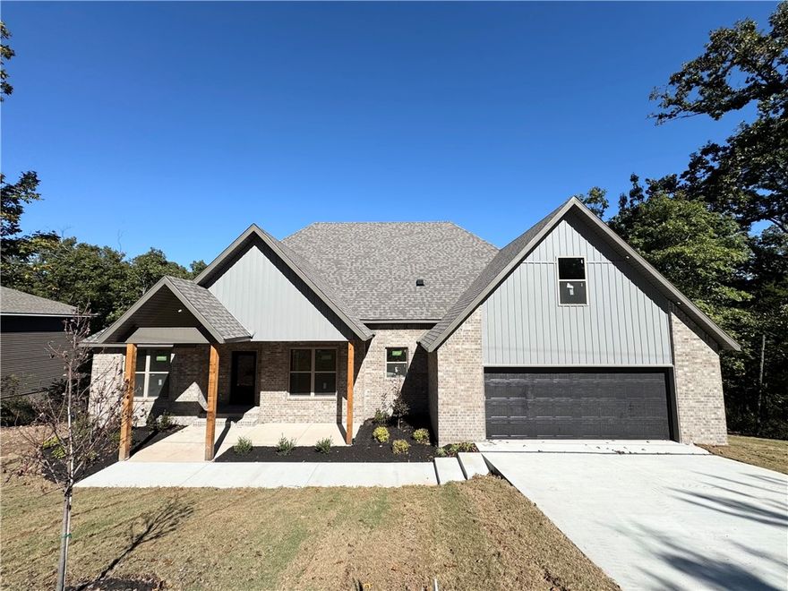 Discover this beautifully crafted 4-bed, 3-bath home featuring a smart split floor plan that perfectly balances privacy & open living. The great room showcases a vaulted ceiling & shiplap fireplace — the ideal spot to unwind or host friends. Enjoy luxury vinyl plank floors throughout, granite countertops, & sleek under-cabinet lighting in a kitchen built for both style and function. A spacious 9x9 pantry keeps everything organized, while the dedicated office makes working from home easy. Generous bedrooms, timeless finishes, & fresh landscaping create a space that feels refined yet inviting. With an oversized garage & modern upgrades at every turn, this home blends beauty, comfort, & practicality — truly a must-see. **SPECIAL FINANCING INCENTIVES AVAILABLE THROUGH BUILDER'S PREFERRED LENDER**