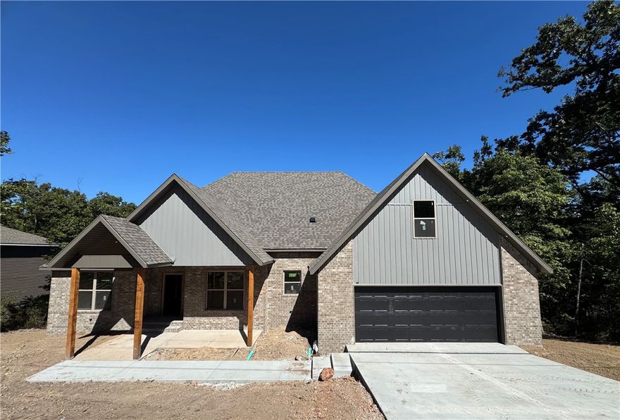 Discover this beautifully crafted 4-bed, 3-bath home featuring a smart split floor plan that perfectly balances privacy & open living. The great room showcases a vaulted ceiling & shiplap fireplace — the ideal spot to unwind or host friends. Enjoy luxury vinyl plank floors throughout, granite countertops, & sleek under-cabinet lighting in a kitchen built for both style and function. A spacious 9x9 pantry keeps everything organized, while the dedicated office makes working from home easy. Generous bedrooms, timeless finishes, & fresh landscaping create a space that feels refined yet inviting. With an oversized garage & modern upgrades at every turn, this home blends beauty, comfort, & practicality — truly a must-see. **SPECIAL FINANCING INCENTIVES AVAILABLE THROUGH BUILDER'S PREFERRED LENDER**