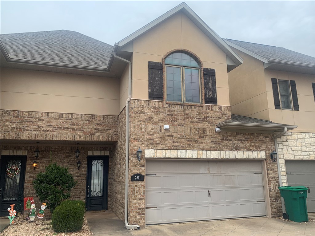 Super location near I-49, Mercy, Pinnacle & Uptown Rogers entertainment, shopping & restaurants! This roomy condo features two upstairs bedrooms each with full bath suites and a bonus landing room. The main level is open living, dining and kitchen with all appliances. Enjoy the outdoor patio and 2 car garage. Call for your tour!