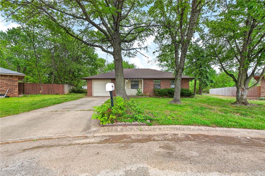 Charming one-owner home nestled in a well-established neighborhood at the end of a quiet cul-de-sac. This all-brick, single-level home offers three bedrooms and one full handicapped-accessible bath. Upgrades include a new roof (2023), new furnace (2011), and new water heater (2005). The fully fenced, level backyard features mature trees for added privacy and includes a 10’x12’ storage building that conveys. Washer, dryer, and refrigerator convey with an acceptable offer. Conveniently located just minutes from trails, downtown Rogers, shopping, dining, and entertainment. Whether you are searching for a well-maintained primary residence or an excellent investment property, this home is ready to welcome its next owner.