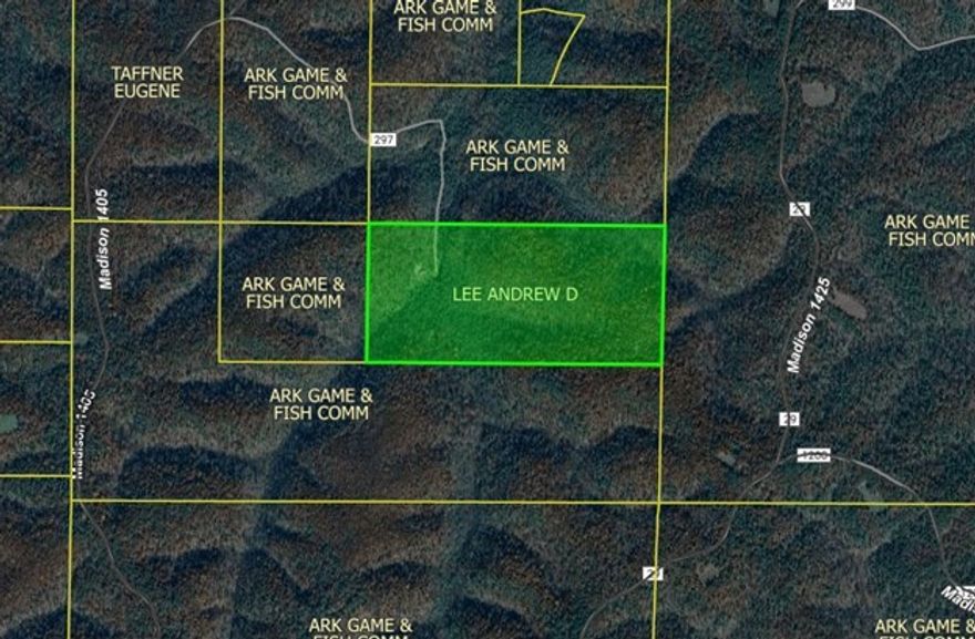Tucked deep within the Madison County Wildlife Management Area, this extraordinary 80-acre inholding at Scotland Hollow offers a level of privacy, beauty, and seclusion rarely found in Northwest Arkansas. Completely surrounded by preserved public land, the property features a 1,200 SF rustic cabin with a proven off-grid solar system and new batteries, allowing true independence without sacrificing comfort. Less than 100 feet from the front deck is a year-round, spring-fed bluff pool with clear, swimmable water—an exceptional trophy feature that defines the property. Additional springs, caves, rock formations, and mature timber add to the sense of a private natural preserve. The bluff-lined pool sits at the base of towering stone walls and holds water year round, creating a natural swimming hole just steps from the cabin. The setting delivers unmatched tranquility, wildlife, and long-term protection, making this a rare opportunity to own a secluded Ozark sanctuary with remarkable character & end-of-the-road privacy.