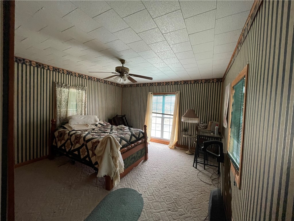 Home on one plus acres. 4 bed, 1 bath with Oak wood floors downstairs. This would be a great Investment property. With a little TLC, can flip OR would make a nice rental. Pretty views off of back porch. Priced to sell! Nice shop building! Property being sold as is