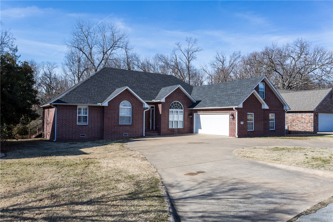 This home has it all! Curb appeal to the max w/side load garage & circle drive for guests. Maintenance free exterior. Entertain with outdoor living space featuring newly added covered composite deck. Enjoy secluded wooded view. Hardwood floors throughout every room have been beautifully refinished. Additional room above garage is 350 Sq Ft. perfect easy access storage & could easily be finished for bonus rm. Completely remodeled hall bath with walk-in shower. New roof-2015. New high efficiency HVAC-2017.