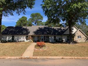 CLASSIC HOME in The Highlands subdivision off Hilltop Drive. Outside boasts a large lot, beautiful painted brick. lovely rock, a brand new roof, a detached storage building and easy access (no stairs) from all exterior doors. Inside you'll find freshly painted walls, all new flooring and so much livable space in this 4 BR, 3 1/2 BA home. Eat-in kitchen has granite countertops with a large island and lots of storage. Kitchen opens to spacious living room with wood burning fp. The master features a sitting area and spacious closet, walk-in shower and garden tub. Large BRs with two sharing a Jack-n-Jill BA and one ensuite BA, that serves as a hall BA, off the 4th BR. Formal DR, large office plus a great bonus/storage room off the double garage! One owner home.