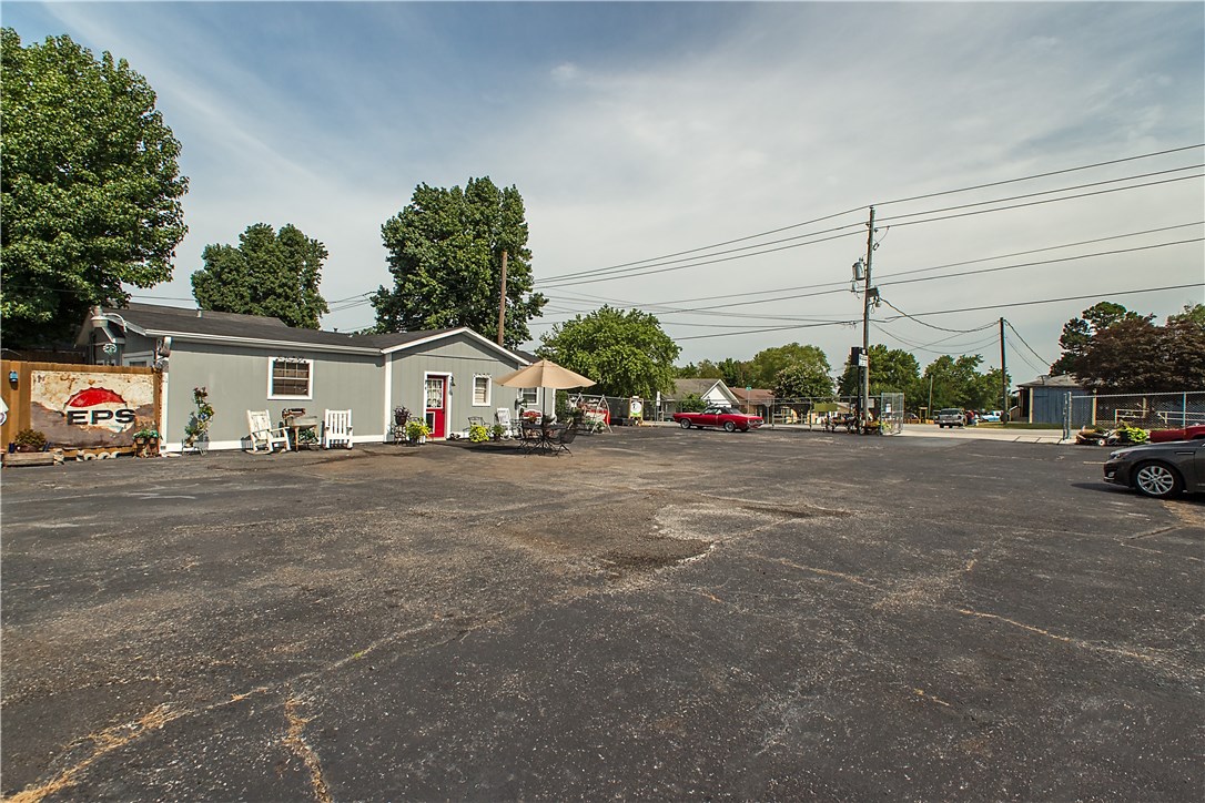 Excellent Commercial Business Opportunity!!! Great business location near downtown Rogers and close to 71B. Perfect for office, car lot, antique store, mechanic shop, or any other small business. Huge parking lot, with 30 parking spots and more that has been recently resurfaced. Easy access to business from home -- right next door! What is included : 3 bedroom, 1 bath home; office; parking lot and all of it is fully fenced. Nice outside bar area for relaxing. Current gate can be converted into electric/automatic. Also listed as Residential - please see MLS #1086097.