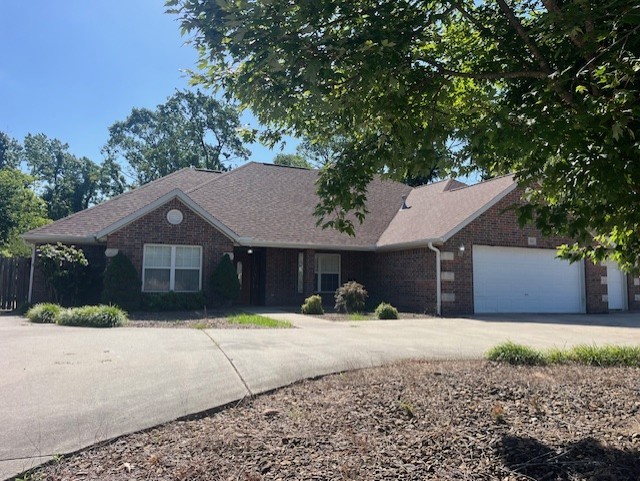 Beautiful 4 bedroom 2 1/2 bath with spacious 3 car garage and circle drive in Tunbridge Subdivision. Large kitchen with double ovens and open space to work in. Large walk-in pantry. Eat in kitchen and a formal dining area. Office room as well! Split floor plan, all wood floors. Ample walk-in closets with built ins! Fireplace in living room and primary bedroom suite. Large covered back patio with private fenced in yard. All of this close to trails, Downtown Square and everything Bentonville has to offer.