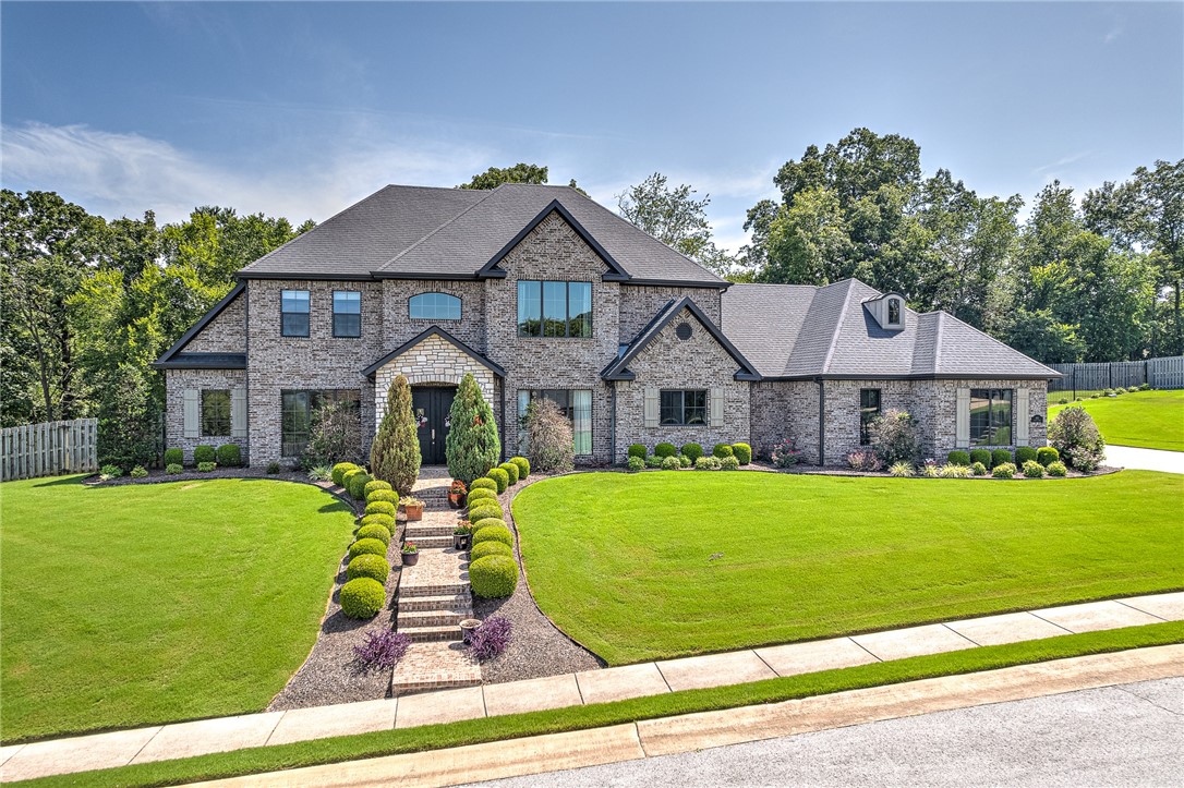 Nestled in Bentonville's Chattin Valley, this exceptional custom home
offers urban convenience near trails and the Community Center. Elegant
hardwood floors, crown molding, and built-ins run throughout. The airy
living room seamlessly connects to the eat-in kitchen and screened
patioāperfect for gatherings. The kitchen boasts high-end Thermador
appliances, a large island, granite countertops, and an oversized gas
range with a pot filler. The spacious primary suite features a
spa-like bath. A media room with surround sound, wet bar, and a fenced
yard make it an entertainer's dream. Safety features include a storm
shelter and surveillance cameras. An intercom system,
climate-controlled electronic closet, and home office add modern
convenience. The insulated garage completes this refined yet
functional home.