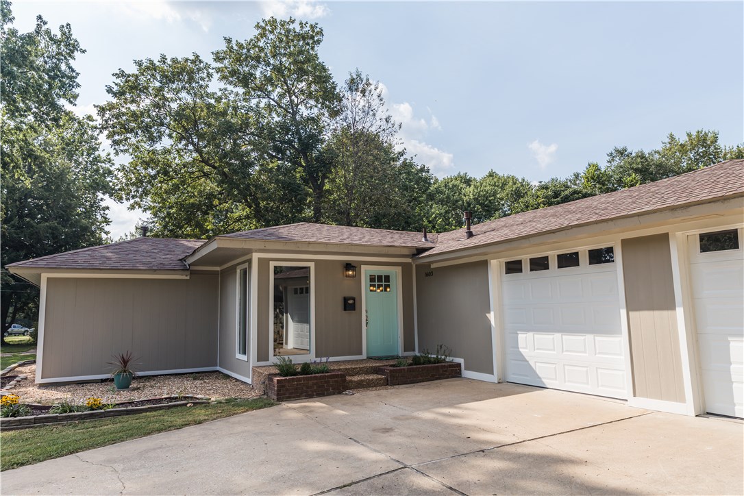 ONE OF A KIND REMODELED 3 BEDROOM, 1 OFFICE AND 2 BATH HOME ON A BEAUTIFUL ¾ ACRE LOCATED IN THE HEART OF ROGERS. Open floor-plan, large living space, eat-in kitchen, granite counters, high-end wood laminate flooring, loads of natural light, new hvac system, new windows, new fiber cement siding, new garage doors, updated electrical, appliances and plumbing. Huge 4 car garage/workshop, large back deck. Back yard large enough to build an in-law suite or Airbnb. Prime location, is priced to sell. Don’t wait. Homes like this don’t come along often.