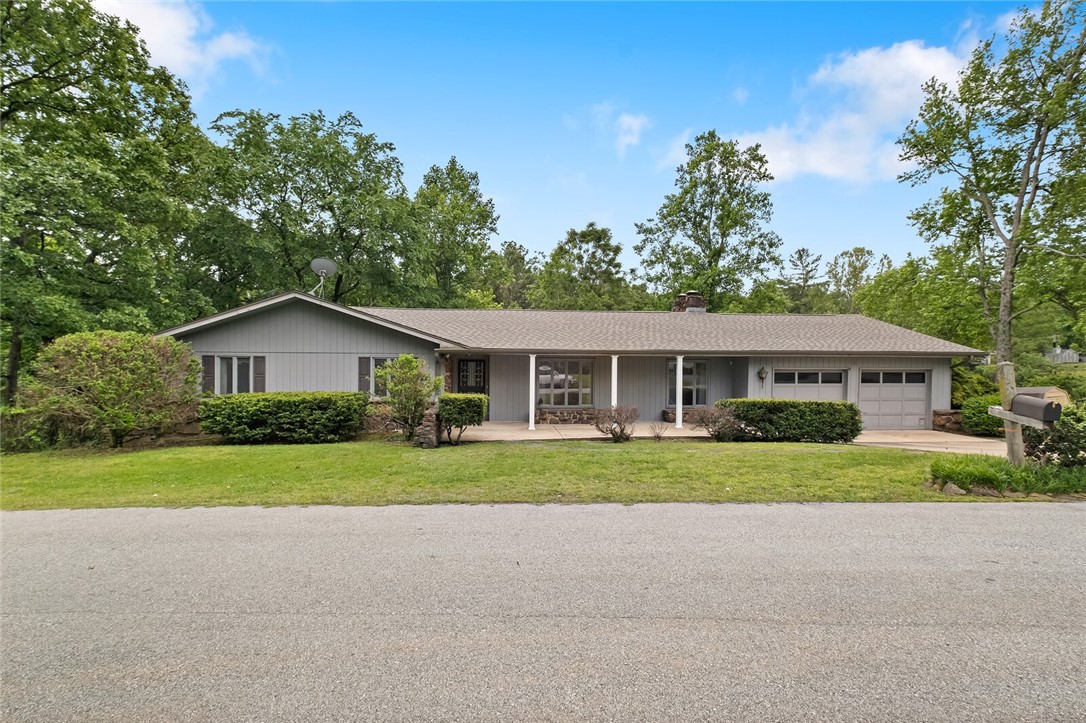 This large, well-loved one owner home is situated just a few blocks from downtown Rogers in a peaceful, quiet neighborhood close to Lake Atalanta. The private corner lot offers a welcoming feeling, providing a sense of seclusion in a serene setting. This spacious home has 6 bedrooms! Four upstairs and two downstairs. Upstairs has two living areas that are generously sized, perfect for entertaining or relaxing with family and friends. The basement is another huge living area (a 75 guest wedding took place here!) with a great interior workshop, access to the outdoors, full bathroom, and huge storage room for all of your holiday decorations.
Outside, the property features a tiered, well-maintained yard with plenty of space for outdoor activities and relaxation. The mature trees provide a natural canopy and shade, creating a peaceful and tranquil setting. The neighborhood itself is quiet and family-friendly, making it the perfect place to call home.
You need to come see it to fully appreciate it!