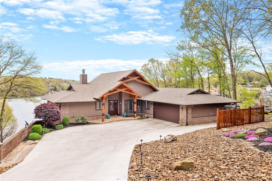 VIEWS FOR DAYS from this beautiful, newly renovated Stonehaven lake home! One of Loch Lomond's finest properties! This property offers all of the interior and exterior amenities expected from luxury lake living! The exterior boosts professional landscaping, wrap-around deck with bar top overlooking lake, covered boat house, custom stone patio, golf cart path, electric tram and waterfall with bridge swim deck. Interior offers views from each room with a light bright design style. This renovation not only expanded the home's hsf and floor plan, but upgraded major systems, roof, flooring, appliances and much MORE! Washer, dryer, refrigerator, custom sauna and shuffleboard game table all convey with sale. From the light hum of the fishing boats, to happy hour sunsets at the deck bar, to tubing these waters with friends, you do not want to miss the opportunity to own this lake home!