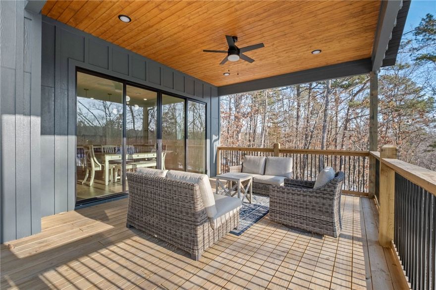 Modern design meets wooded serenity in this stunning new-construction home. Clean lines, designer exterior finishes, and expansive windows create a bright, contemporary feel throughout. A sleek entry, open layout, and elevated architectural details set this home apart. Enjoy seamless indoor–outdoor living with a large covered deck and spacious lower patio overlooking the trees—perfect for relaxing or entertaining. A rare Bella Vista find offering privacy, style, and quality craftsmanship in a peaceful setting. Builder includes a 1-year warranty, and Approved borrowers will receive a closing cost credit of 1% of loan amount up to $5000 on their Closing Disclosure on their loan closing with Envoy Mortgage Branch NMLS #2659248 and Branch NMLS #2579798.