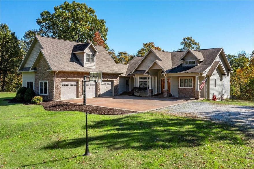 24 magical acres near Coler Park Trails and a lovely custom built home! This home was designed to enjoy the views! Home features over 5000 sq. ft. with a self contained walk-out basement apartment (2 bdrm, 2 bath). Detached shop building is 30' x 40'. Primary suite on main floor has a beautiful bath with curbless shower entry.  3 car garage is extra deep! Oversized mud room/utility room, extra-large dining space, and an office with privacy doors. Bonus room & bath are located on 3rd level. This property adjoins Versailles and Talamore Subdivisions. Shown by Appt only!