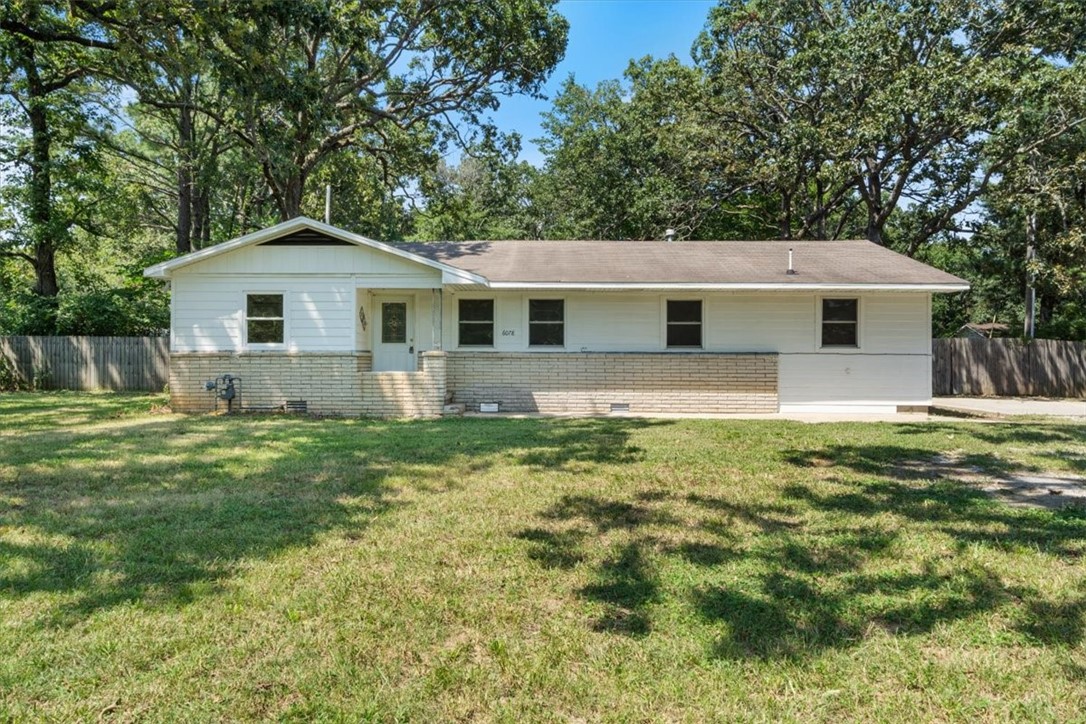 **Charming and Affordable Family Home**
Discover this well-built home featuring beautiful hardwood floors and a prime location. Nestled on a spacious lot shaded by mature front-yard trees, it offers both privacy and room to play. The fenced backyard opens to a serene wooded area, creating a peaceful setting where pets can roam freely and nature is right at your doorstep. Refrigerator does convey with the property.
