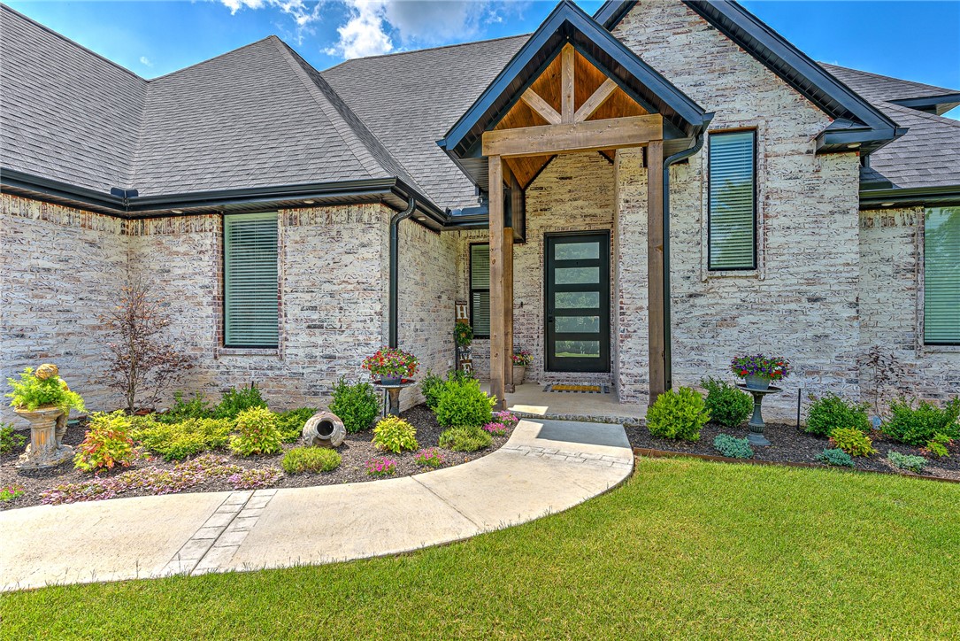 Custom designed home w/impeccable designer finishes, cathedral ceiling w/beams, large windows for natural light & open, spacious layout. Gas FP w/built-ins each side. Gourmet kitchen has huge island w/single basin farm sink as well as separate counter space w/room for additional bar seating & large eat-in kitchen, all open to living room, making this home ideal for entertaining. Black SS KitchenAid appliances. Wood floors throughout w/carpet only in primary closet & on stairs. Private study w/full wall of built-ins. Split floor plan w/luxurious primary suite on separate side of home w/coffered ceiling, freestanding tub, separate vanities & separate over-sized fully tiled WI shower. 2 other BRs opposite side of home w/WI closets. Upstairs suite has its own full bath. Mudroom access from garage, large laundry room w/hidden laundry hampers & access to primary suite. Covered outdoor patio features gas FP, fully fenced w/spectacular view. Home shows like a model home. See attached for complete list of amenities.