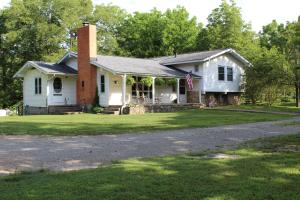 This home is just 2.5 miles from Yellville with highway frontage, but a wonderful country setting. Large trees, pond, garage/shop building and some fencing are on the property. The house is an older farm house with original hardwood floors. With its split level floor plan, there are many options to create the living space that fits your needs. Bring your horse or just enjoy the 5.51 acres M/L of country setting.