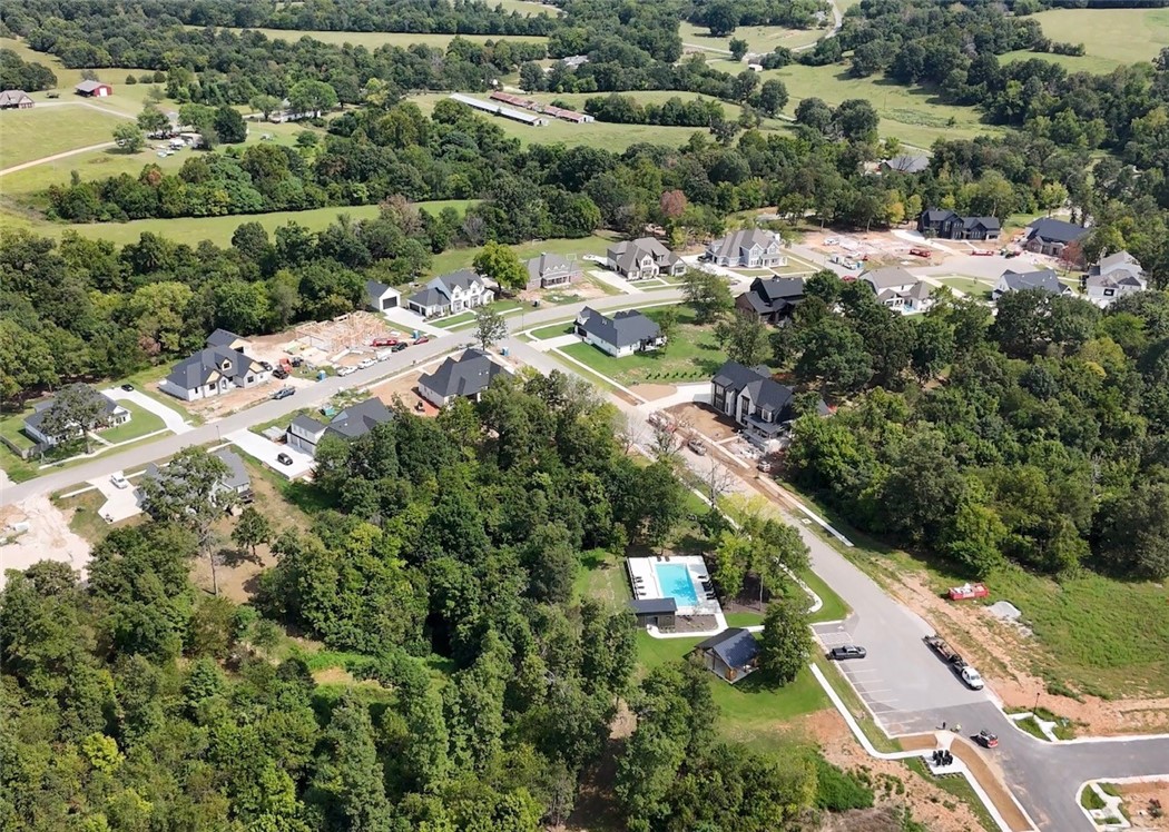 Lot 34 at Blackberry Ridge is a 0.70-acre lot nestled within the natural beauty of Fayetteville. This scenic homesite offers the perfect opportunity to create your dream home. Conveniently located with quick access to I-49, you're only minutes away from Fayetteville's best shopping, dining, and entertainment. Enjoy the community's exclusive amenities, including a refreshing pool, a welcoming pavilion, and tranquil walking trails through the neighborhood. *Agent Owned*