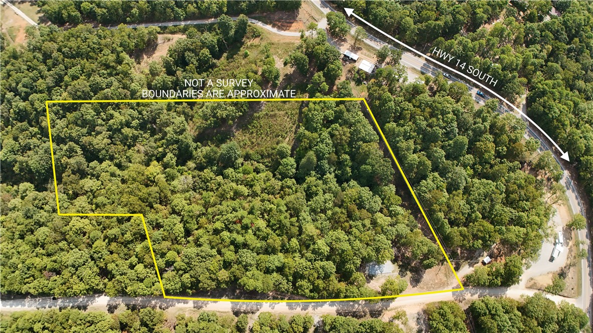 Escape to the heart of the Ozarks! This stunning 6 AC M/L tract offers a rare opportunity to own your own slice of paradise just off Highway 14 South in beautiful Yellville, Arkansas. Nestled among rolling hills, mature hardwoods, and serene natural beauty, this property provides the perfect setting for a private getaway, future homesite, or recreational retreat. Included is a 16 x 40 ft. pad ready for a two-story structure of your choosing. Property has access to City water as well as a spring, power and fiber optic. Whether you're looking for a nice place to build, a weekend escape, or investment land in a growing area, this property offers unbeatable value and natural beauty. Close to the Buffalo National River, Bull Shoals Lake, and countless outdoor recreation opportunities. Don't miss this one! Priced to sell quickly. Call for showing today!