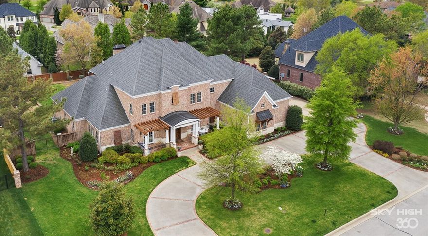 This sophisticated estate is wrapped by lush landscaping and manicured grounds on 0.76 acre lot in Pinnacle Country Club. Custom Built by Mark Smith, this property features a two-story foyer that introduces a formal study with wall-to-wall built-ins and privacy French doors and formal dining room. Spacious open living room with stone surround fireplace, wooden beams & dual set of French doors open to a fully equipped chef's kitchen with breakfast room & butler's pantry. The main floor owners suite boasts a jacuzzi bathtub, walk-in shower, dual sink vanity and walk-in closet with an additional 15x15 private flex space. Upper level features all ensuite bedrooms, spacious media room & bonus room/virtual learning space (optional 5th bedroom suite) with incredible bonus walk-in storage room. Outside enjoy the covered veranda with built-in grill, prep sink and fireplace overlooking gorgeous gardens & mature trees. 3 car garage + golf cart space, tornado shelter in Bentonville Schools.