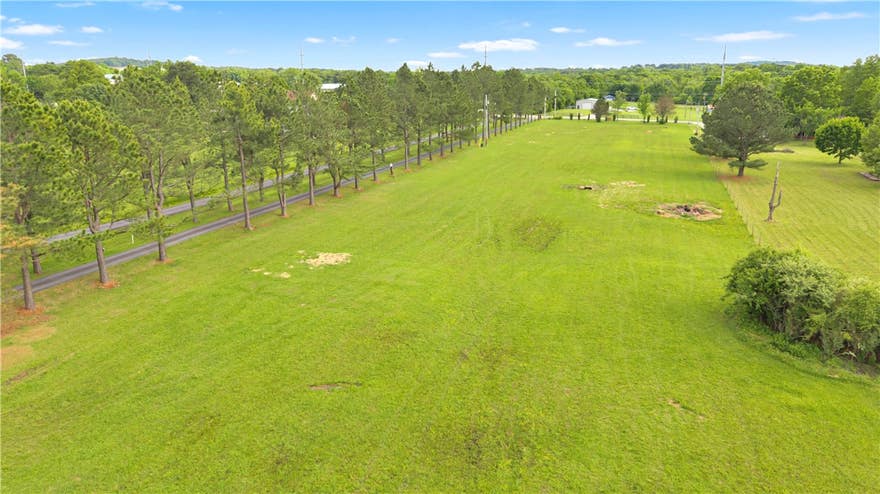 Prime 2-acre lot conveniently located just minutes from shopping, dining, new Woodland Jr. High, Lake Fayetteville, and the Botanical Gardens, this property offers the benefit of being outside city limits while still providing easy access to everyday amenities. Preliminary work has already been completed, flat-cleared lot and a successful perc test giving buyers a strong head start in the building process. Plenty of room for your vision of building a Dream Family Estate - multiple building sites, pool, shop, guest house, endless opportunities. Don't miss your chance to own a ready-to-develop property in a highly sought after location in Fayetteville.