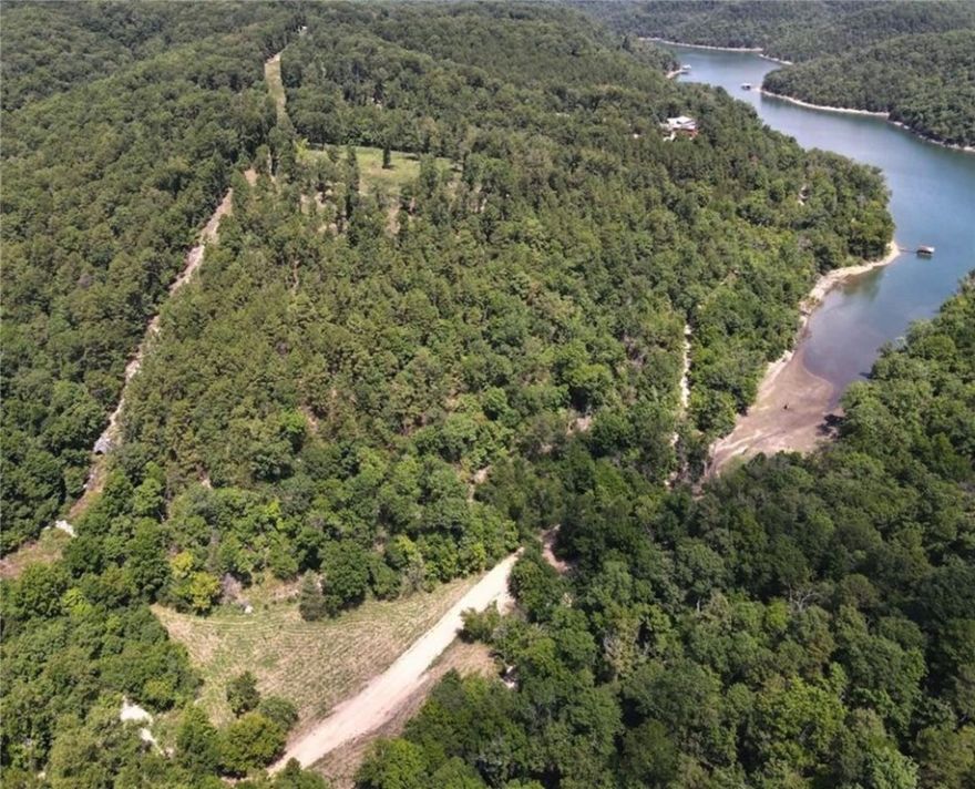 This 18.23-acre parcel in Eureka Springs offers a beautiful view of Beaver Lake and endless potential. Zoned for nightly rentals, the property can be divided individually or kept together for a larger private retreat or investment/development. The upper portion is cleared and ready for construction—ideal for one or more homes with potential for stunning lake views, fresh mountain air, and unmatched access to the natural beauty of the Ozarks.