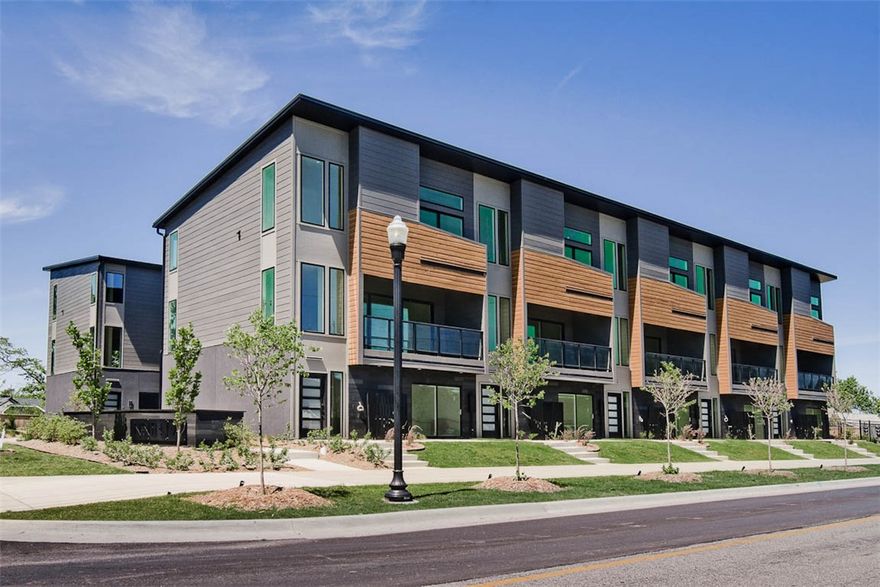 WELCOME TO DISTRICT 9/A! 30-year fixed-rate financing available! Modern living located across the street from Airship Coffee! Situated near the Crystal Bridges trail and the downtown square, this brand new front interior unit offers both convenience and contemporary design. The property includes an attached 2-car garage and a community bike wash station, perfect for outdoor enthusiasts. Additional neighborhood amenities feature an outdoor grill and a fire pit, ideal for social gatherings. The contemporary kitchen is a highlight, featuring European cabinetry, exquisite quartz countertops, and a waterfall island. With modern fixtures and custom finishes throughout, this condo exemplifies quality. Enjoy the elegance of glass balconies and the comfort of 3 luxurious bedrooms. The condo also includes 3.5 baths, designed with style and functionality in mind. Experience the ultimate luxury lifestyle with this exceptional property. Additional units are available.