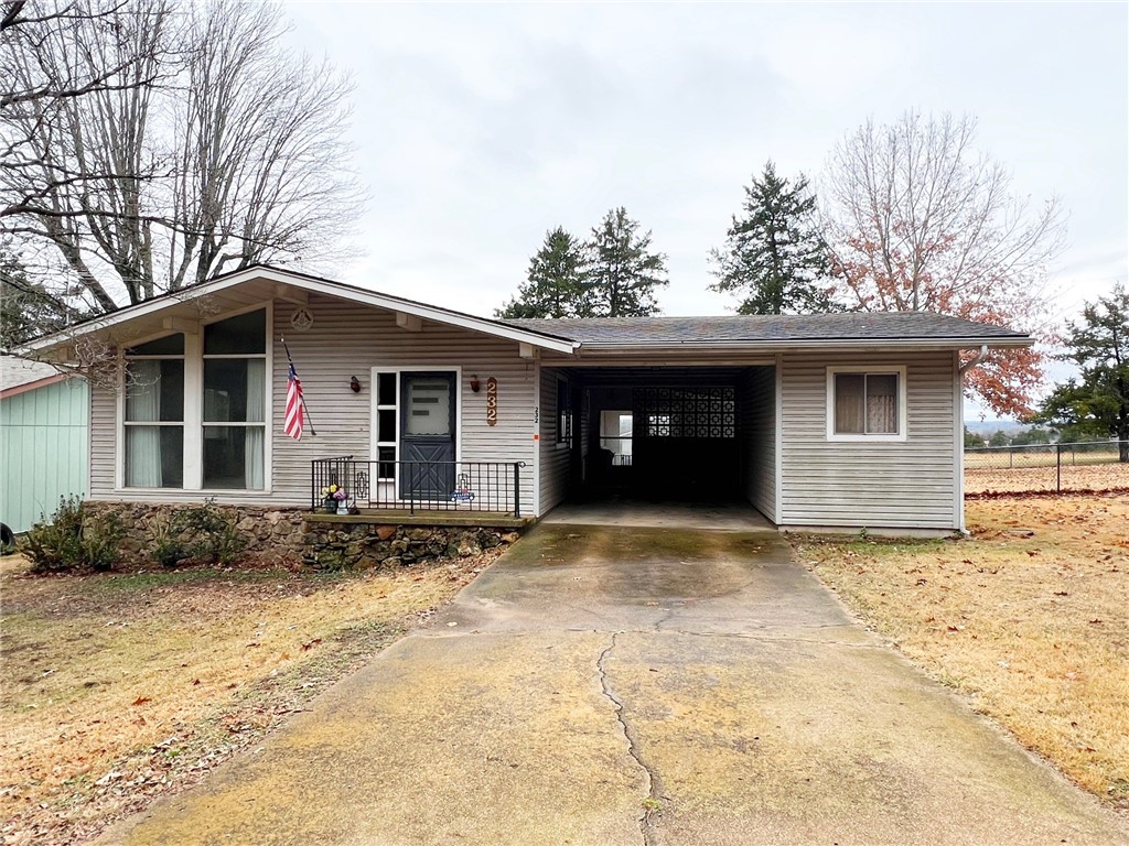 If you have been looking for that perfect lake getaway, take a look at this cutie. This 2 BR 1 BA has a fenced back yard so you can bring your fur kids. The back yard looks over Diamond Hills Golf Course. There is a one car carport/breezeway with a workshop/office attached. After a long day on the lake or golf course, enjoy your favorite drink in the sunroom overlooking the golf course. This property is selling AS IS.