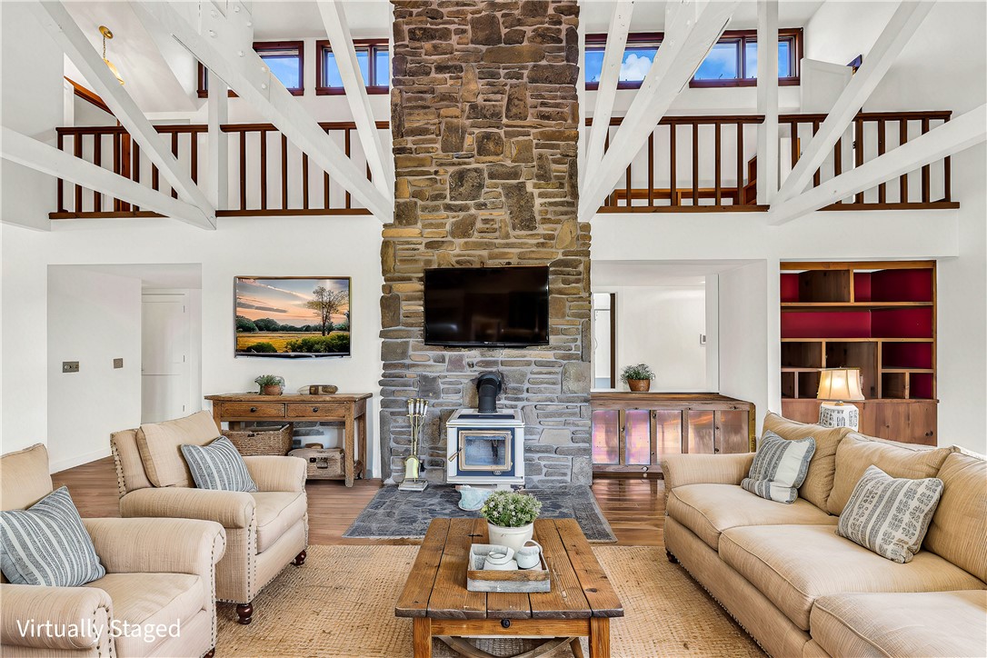 Private country estate waiting for your special touch in Washington County between Tontitown and Fayetteville. Nestled on a hill with just over 8 acresā 3143 sq. ft. house, 778 sq. ft. guest house and 40x60 barn/shop. Built at the end of the mid-century modern movement, this 1980s home has 4 bedrooms and 3 full bathrooms. Cathedral ceilings, wood floors, wood beams and native stone fireplace anchor the great room. The kitchen opens to a large sunroom with granite countertops and stainless-steel appliances. Main house roof was replaced in 2022 and metal siding added in 2021. Guest house is included in the total square footage with full bath, kitchenette and loft. The metal barn/shop has wood trusses, full lean-to and enclosed office/tack room. Great opportunity with unlimited options for use ā residential, commercial, rental or hobby farm. Decks need attention. Selling AS-IS.