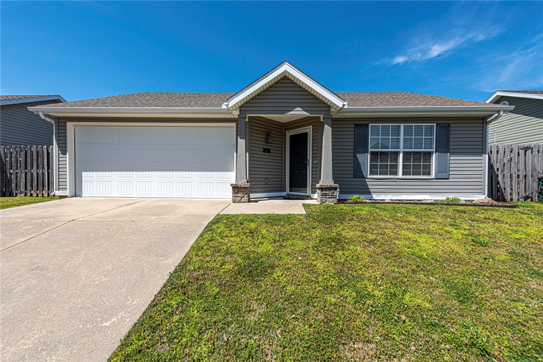 ATNN INVESTORS AND FIRST-TIME HOME BUYERS! This one-owner home with 3 bedrooms 2 bathrooms is located in the desriable Walnut Crossing subdivision is located minutes away from shopping, eateries, parks, schools, I-49, and a short drive away from the University of Arkansas! Inside enjoy an open floor plan with a living room featuring laminate wood floors and an opening into the tiled dining room and L-shaped kitchen with a tiled backsplash, electric range, new microwave, new garbage disposal, dishwasher, and refrigerator included! Relax and rejuvenate in the primary bedroom with a private ensuite! Plus two additional bedrooms and an additional full bath! Plus a patio and fenced in side yard!