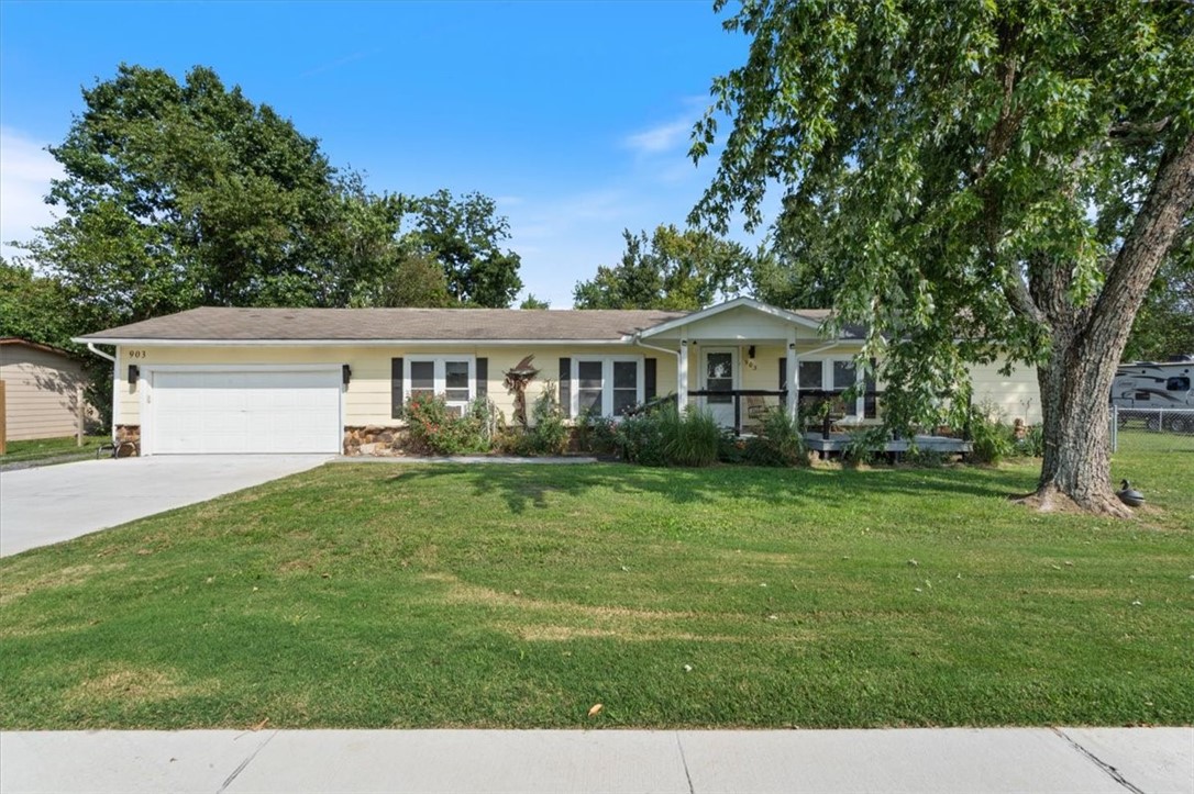 Discover this unique opportunity featuring two income producing homes on a spacious .63 acre property. Perfectly situated along our scenic bike trail system and across the street from Northwest Arkansas Community College. The main home is 1,344 square feet, two bedrooms, two baths. An open floor plan with a lovely living, dining, kitchen area with seating bar, perfect for gatherings. The guest home is separated by a large yard and privacy fence. A separate driveway leads you to the cozy 768 square foot cottage that features living, dining and kitchen spaces, one bedroom and a bath. So many options....a home office space, a private retreat, or room for family and guests. Both properties are currently operating as successful short-term rentals with strong occupancy rates, making this a turnkey investment. Guests love the location, large yard, and access to the trail right outside the front door. This property is a rare find for homeowners and investors alike! 120 SF storage plus safe room in garage.