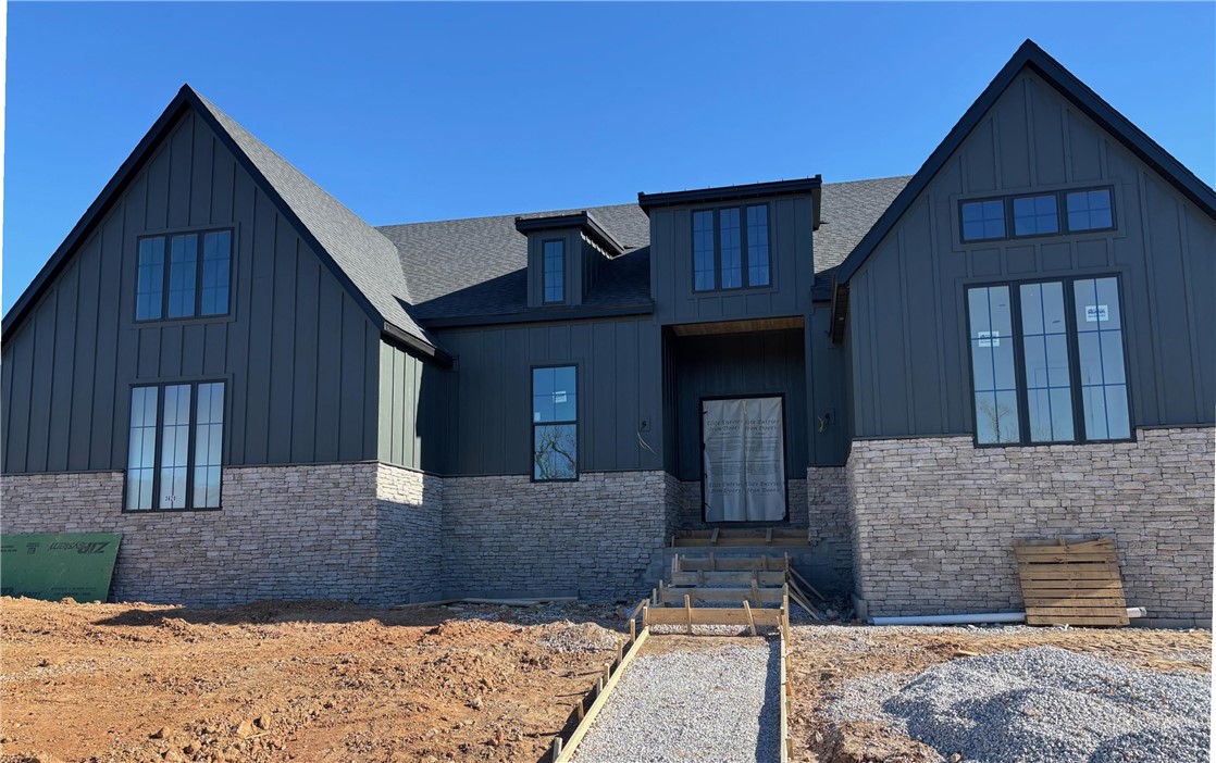 Built by the 2024 Parade of Homes Gold Medal winner! Feast your eyes on our one-story Carson floor plan. This jaw dropping home is filled with luxurious finishes & sits on a large corner lot within walking distance to the community pavilion & green space. This home features a premium quartz waterfall kitchen island, oversized windows, & sliding glass doors, creating an outstanding indoor/outdoor entertaining space. The elegant main suite includes a separate tub & shower with floor-to-ceiling tile, dual shower heads, his/hers sinks on opposite sides of the bathroom as well as a separate office space. The home offers a bonus room that could double as a 5th bedroom, & a three-car garage. You'll find high-quality finishes throughout, such as quartz countertops, GE Cafe appliances, custom cabinetry, a "hidden" pantry, & soft-close cabinets with under-cabinet lighting. Located just 2 miles from the Bella Vista by-pass, 5 miles from Coler Mtn, 7 miles from downtown Bentonville, & 8 miles from Wal Mart Home Offices!