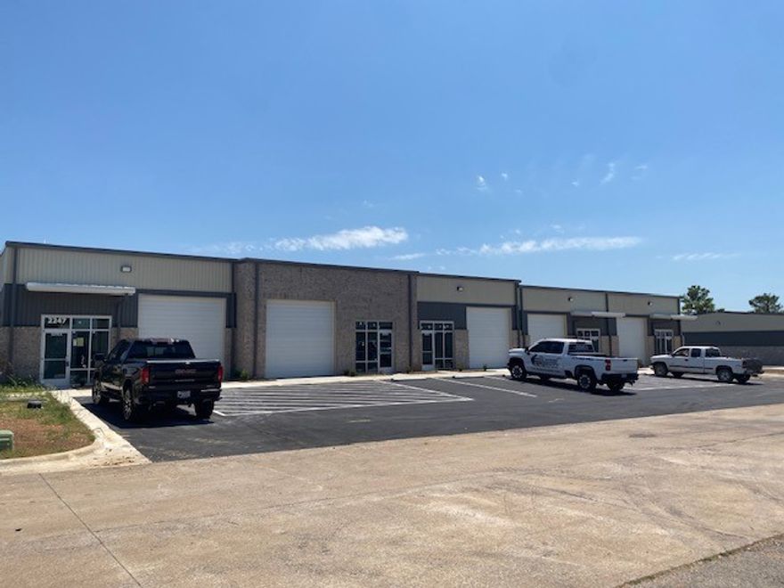 Newly constructed flex warehouse space in the heart of Springdale. Two grade-level 12' roll-up doors per bay with 18' sidewalls and ~ 21' peak height. Tenant has the option to design an office space and/or restroom(s) to suit their needs if necessary. This basic Tenant Improvement Allowance is included in the base rent.  There could be additional cost for more extensive build-out. That cost is negotiable depending upon the level of finish out and lease term and would be added to base rent. This building has 2 total bays (bays are ~ 1,920 sf each) currently available which can be combined or rented individually depending upon what is still available at the time of lease. Lockbox on 2303 Worth Lane, Suite A.  Another adjacent building with approximately 9,100 sf and 5 more bays currently available.